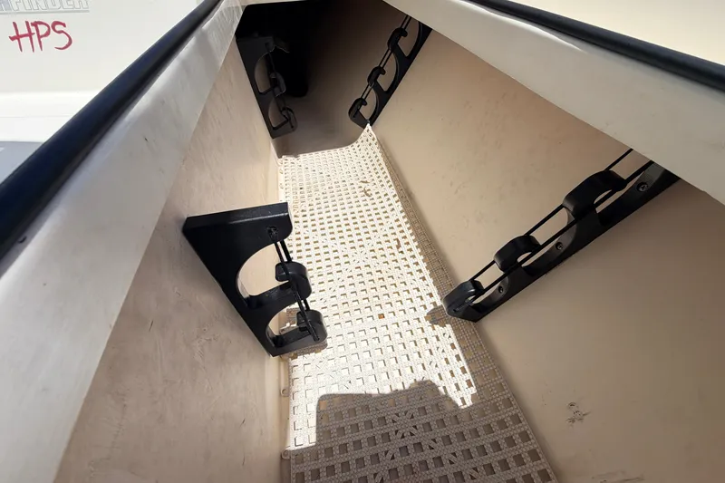 Slide: The Image of Interior view of a 2013 Pathfinder 2300 HPS boat with rod holders and textured flooring. - 78