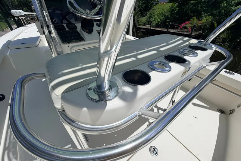 Slide: The Image of 2015 Pathfinder 2300 HPS boat console with rod holders and steering wheel. - 30