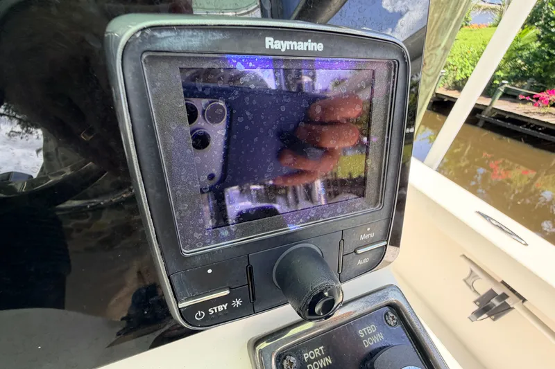 Slide: The Image of Raymarine display on 2013 Pathfinder 2300 HPS boat, showing reflection and water droplets. - 46