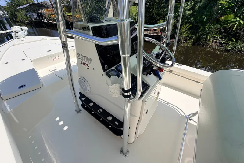 Slide: The Image of 2013 Pathfinder 2300 HPS boat interior with steering console and controls. - 51