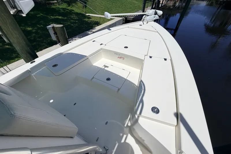 Slide: The Image of 2013 Pathfinder 2300 HPS boat deck, featuring spacious seating and storage compartments. - 69