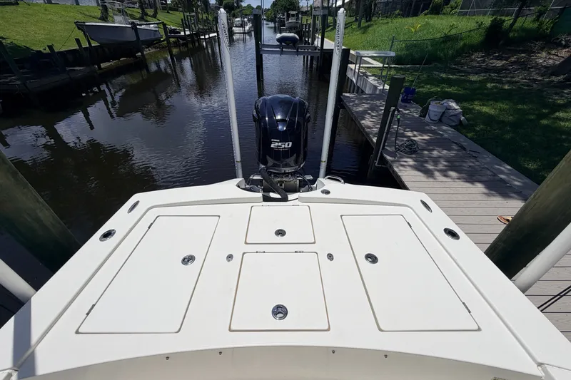 Slide: The Image of 2015 Pathfinder 2300 HPS boat with Yamaha 250 engine docked in a canal. - 11
