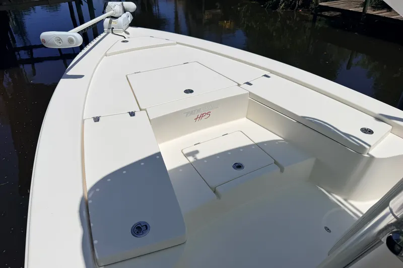 Slide: The Image of 2013 Pathfinder 2300 HPS boat deck with storage compartments and trolling motor. - 68