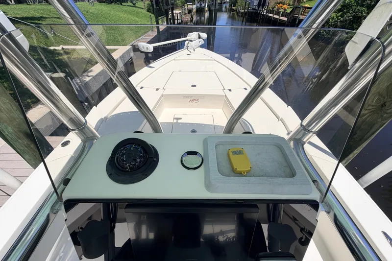 Slide: The Image of 2013 Pathfinder 2300 HPS boat console with compass and navigation equipment. - 50