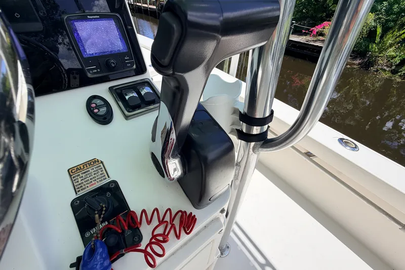 Slide: The Image of Control panel of a 2013 Pathfinder 2300 HPS boat with navigation equipment. - 48