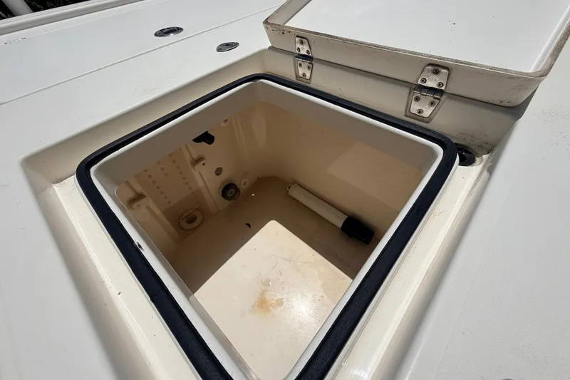 Slide: The Image of Open storage compartment on 2015 Pathfinder 2300 HPS boat deck. - 20