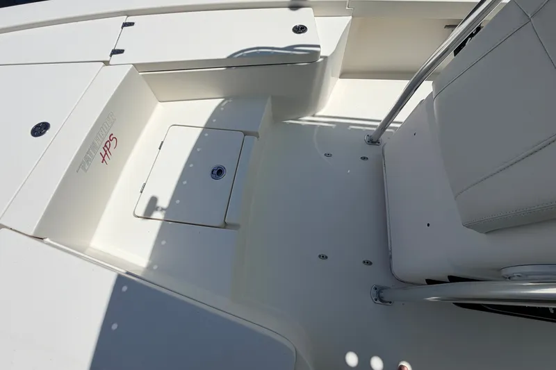 Slide: The Image of 2013 Pathfinder 2300 HPS boat interior with seating and storage compartments. - 70