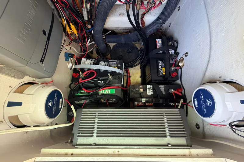 Slide: The Image of Electrical system of a 2013 Pathfinder 2300 HPS boat, featuring batteries and wiring. - 63