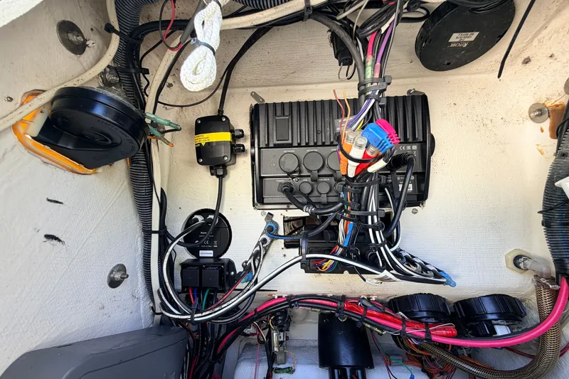 Slide: The Image of Electrical wiring and components inside a 2013 Pathfinder 2300 HPS boat. - 61