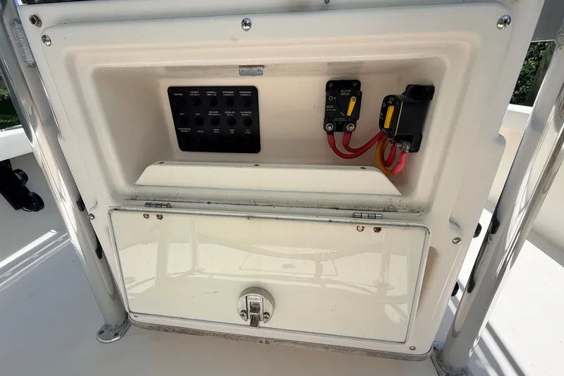 Slide: The Image of Control panel of a 2013 Pathfinder 2300 HPS boat with switches and wiring. - 39