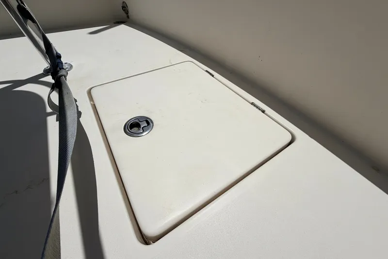 Slide: The Image of Hatch cover on 2015 Pathfinder 2300 HPS boat deck, featuring a secure latch. - 25