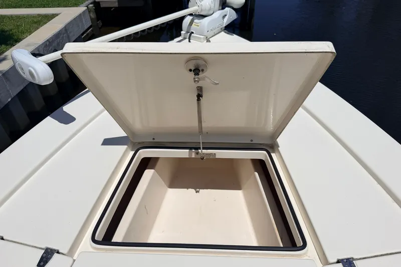 Slide: The Image of Open storage compartment on a 2013 Pathfinder 2300 HPS boat deck. - 83