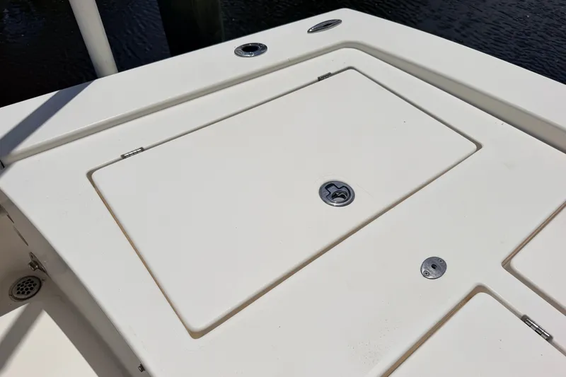 Slide: The Image of 2015 Pathfinder 2300 HPS boat deck with storage compartment and latch. - 16