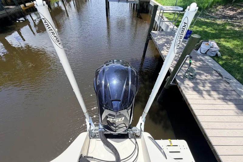 Slide: The Image of 2015 Pathfinder 2300 HPS boat with Yamaha F250 engine, docked by a wooden pier. - 8
