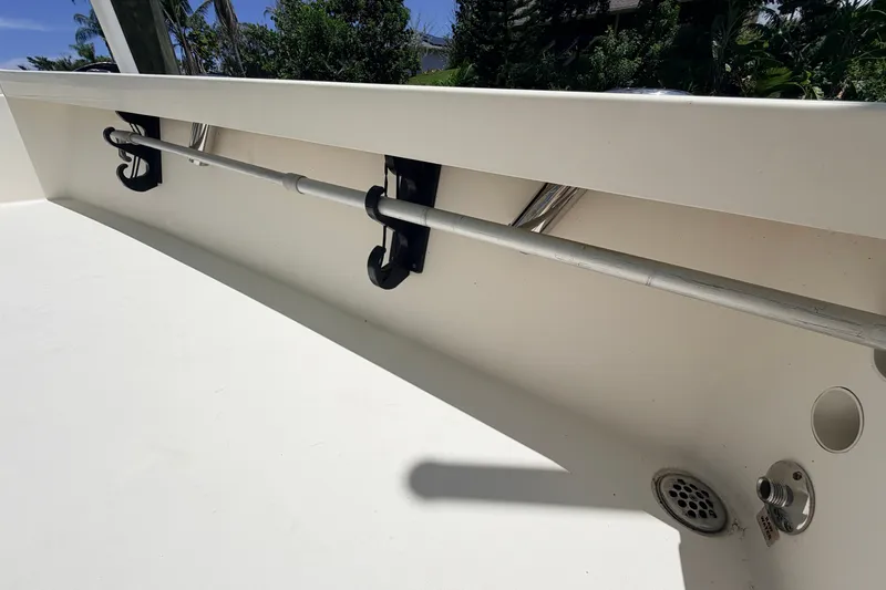 Slide: The Image of 2013 Pathfinder 2300 HPS boat interior with rod holders and drainage system. - 54