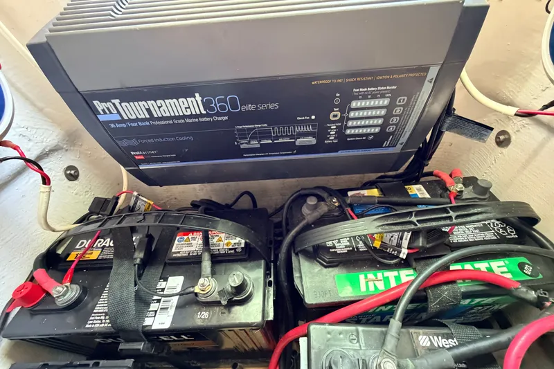 Slide: The Image of Battery setup with ProTournament 360 charger in 2013 Pathfinder 2300 HPS boat. - 65