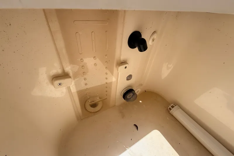 Slide: The Image of Interior view of a 2015 Pathfinder 2300 HPS boat compartment with fittings and fixtures. - 21