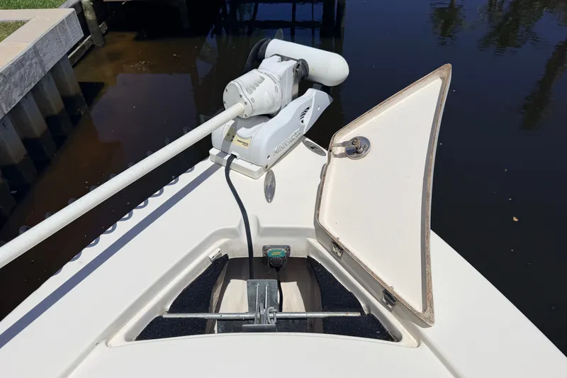 Slide: The Image of Bow of a 2013 Pathfinder 2300 HPS boat with trolling motor and open hatch. - 87