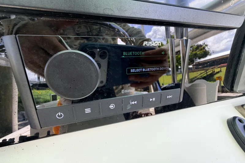 Slide: The Image of Fusion Bluetooth stereo system on a 2013 Pathfinder 2300 HPS boat dashboard. - 45
