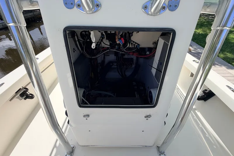 Slide: The Image of 2013 Pathfinder 2300 HPS boat console interior with wiring and components visible. - 58