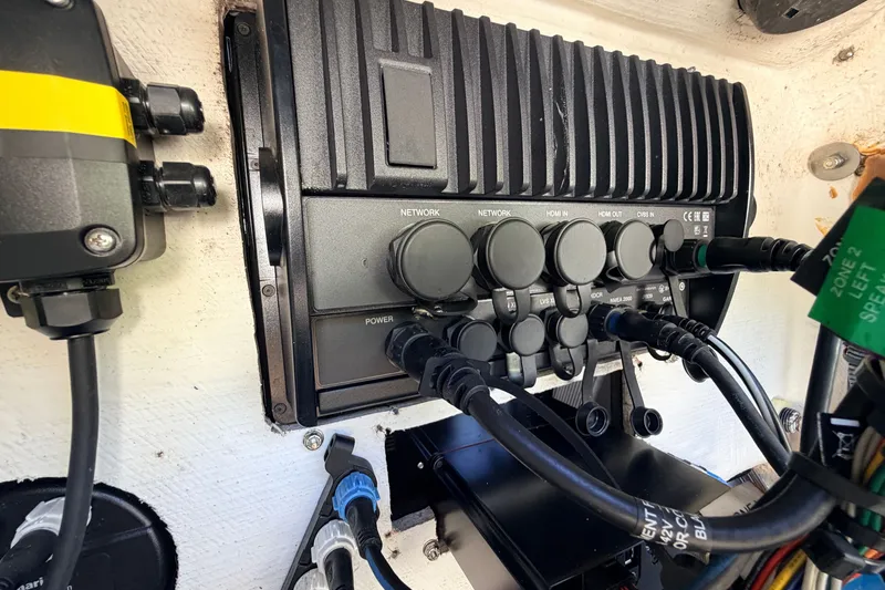 Slide: The Image of 2013 Pathfinder 2300 HPS boat electronics panel with various network and power connections. - 60