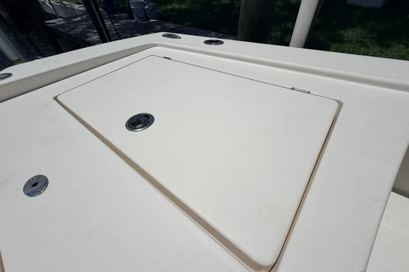 Slide: The Image of 2015 Pathfinder 2300 HPS boat deck with storage compartment and latch. - 22
