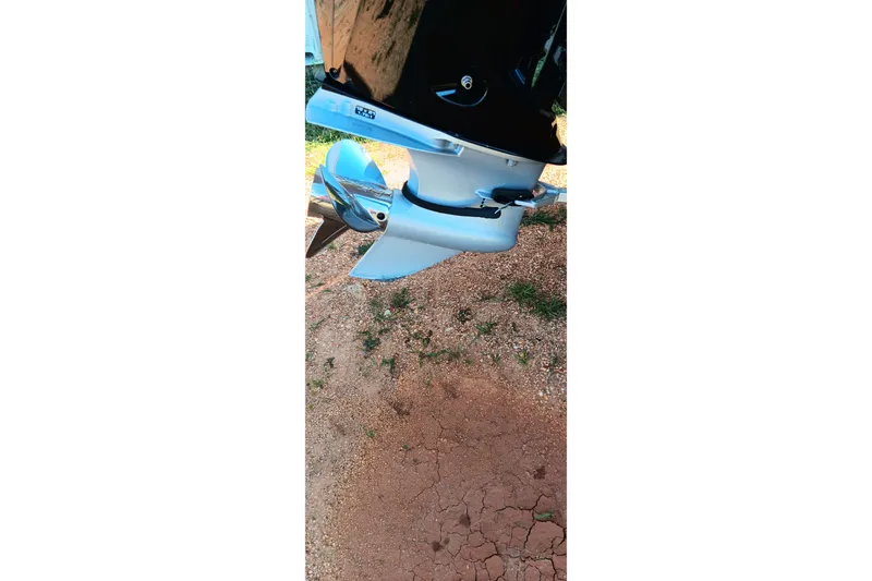 Slide: The Image of Outboard motor of 2025 Ranger ALPHA 208 on cracked ground surface. - 8