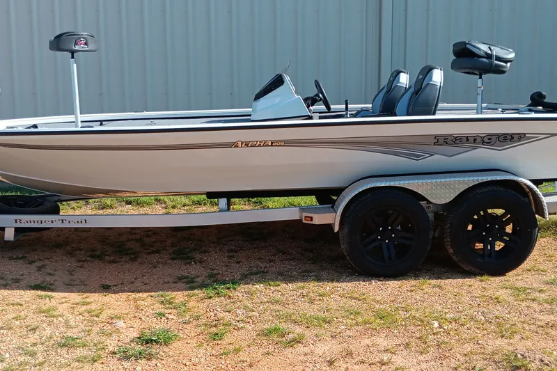 The Image of 2025 Ranger ALPHA 208 boat on trailer, parked outdoors, side view. - 0