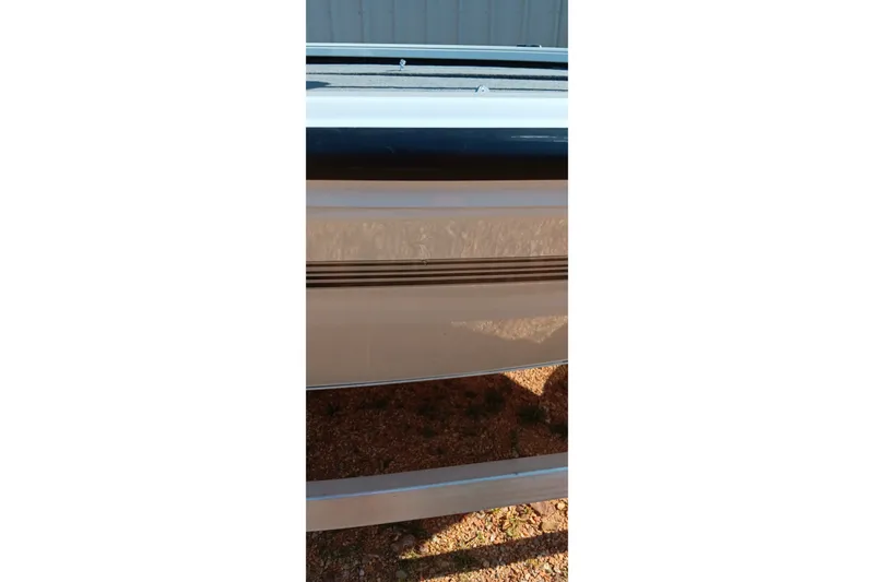 Slide: The Image of Side view of 2025 Ranger ALPHA 208 boat, showcasing sleek design and reflective surface. - 11