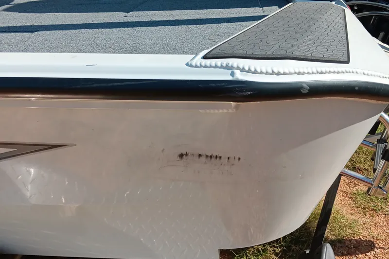 Slide: The Image of 2025 Ranger ALPHA 208 boat with visible scuff marks on the hull. - 15