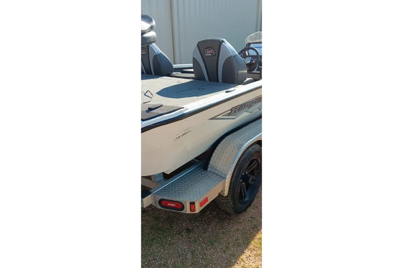 Slide: The Image of 2025 Ranger ALPHA 208 boat rear view with trailer, featuring sleek design and comfortable seating. - 7