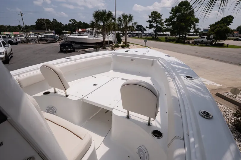 Slide: The Image of 2022 Sea Hunt Ultra 265SE boat with spacious seating and sleek design. - 12