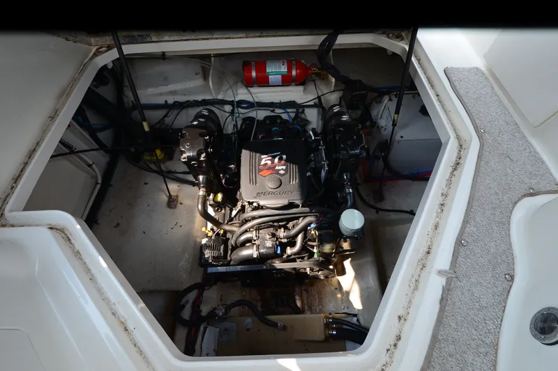 Slide: The Image of Engine compartment of a 2007 Sea Ray 240 Sundancer boat, featuring a Mercury engine. - 15