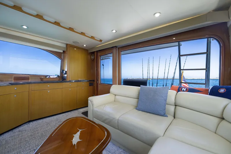 Slide: The Image of Interior of 2001 Viking 55 Convertible yacht with ocean view and luxurious seating. - 34