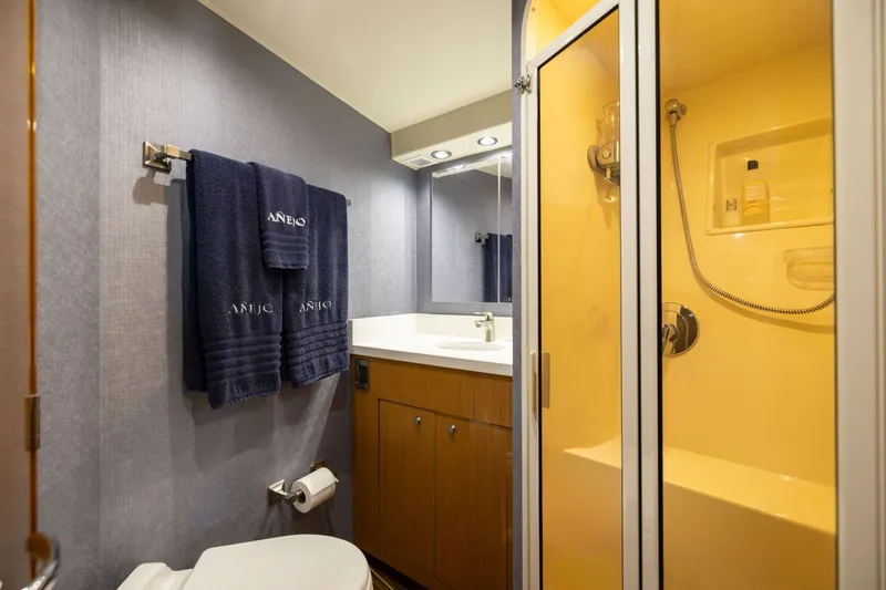 Slide: The Image of Bathroom interior of 2001 Viking 55 Convertible yacht with shower and towels. - 58