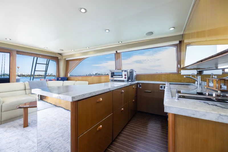 Slide: The Image of Luxurious interior of 2001 Viking 55 Convertible yacht with modern kitchen and scenic views. - 38