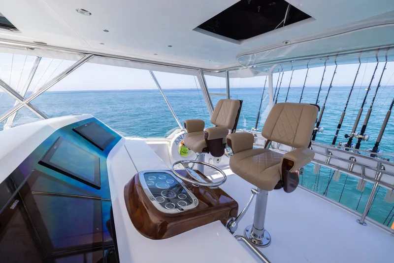 Slide: The Image of Luxurious helm of 2001 Viking 55 Convertible yacht with ocean view. - 2
