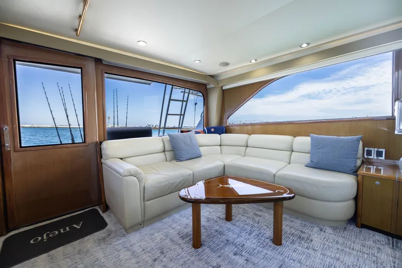 Slide: The Image of Luxurious interior of 2001 Viking 55 Convertible yacht with cream leather seating and ocean view. - 32