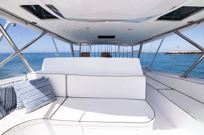 Slide: The Image of Luxurious interior of 2001 Viking 55 Convertible yacht with ocean view and plush seating. - 24