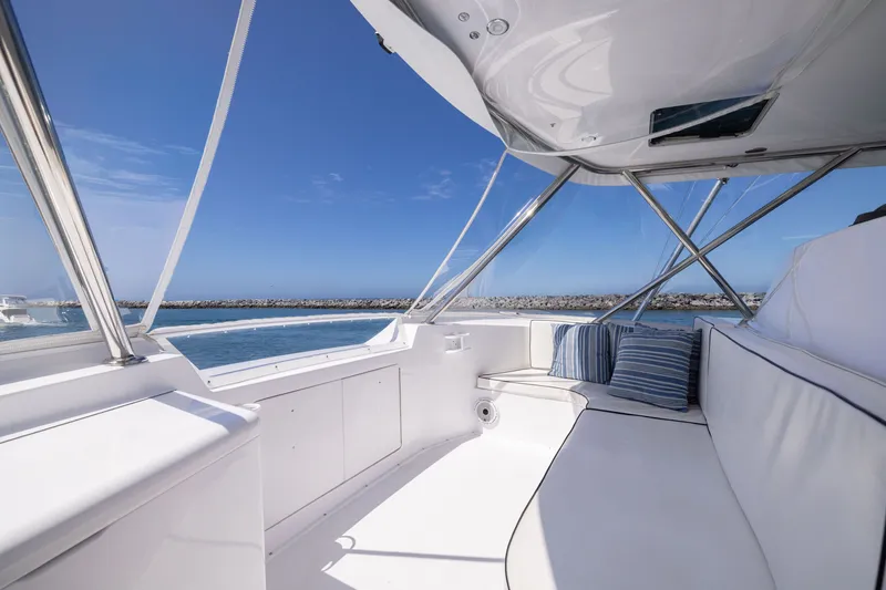 Slide: The Image of Luxurious interior of 2001 Viking 55 Convertible yacht with ocean view and plush seating. - 25