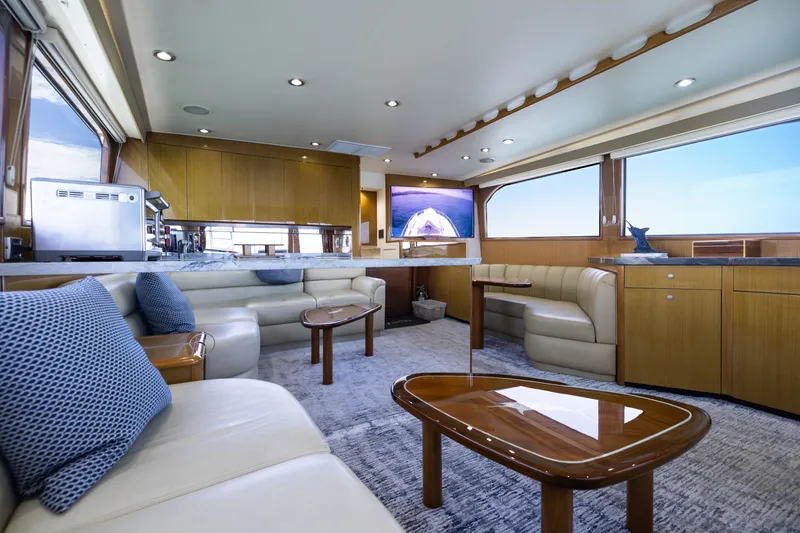 Slide: The Image of Luxurious interior of a 2001 Viking 55 Convertible yacht with elegant seating and modern amenities. - 35