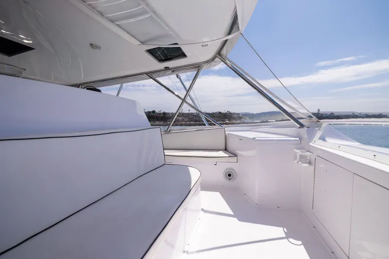 Slide: The Image of 2001 Viking 55 Convertible yacht interior with white seating and ocean view. - 26