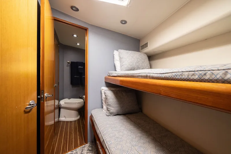 Slide: The Image of Interior of 2001 Viking 55 Convertible yacht with bunk beds and bathroom. - 55