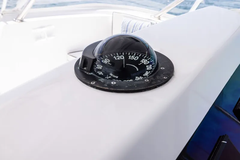 Slide: The Image of Compass on 2001 Viking 55 Convertible yacht, navigating open waters. - 17