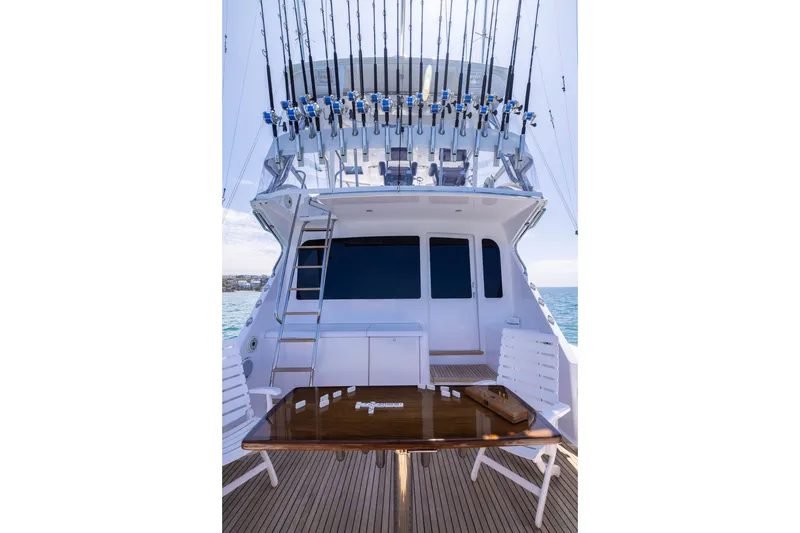 Slide: The Image of 2001 Viking 55 Convertible yacht with fishing rods and deck seating. - 9