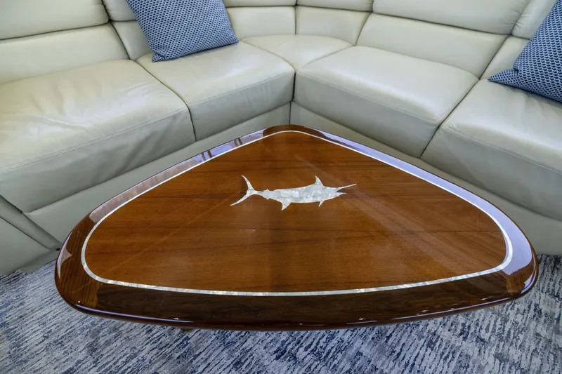 Slide: The Image of Luxurious interior of 2001 Viking 55 Convertible yacht with elegant wooden table and leather seating. - 33