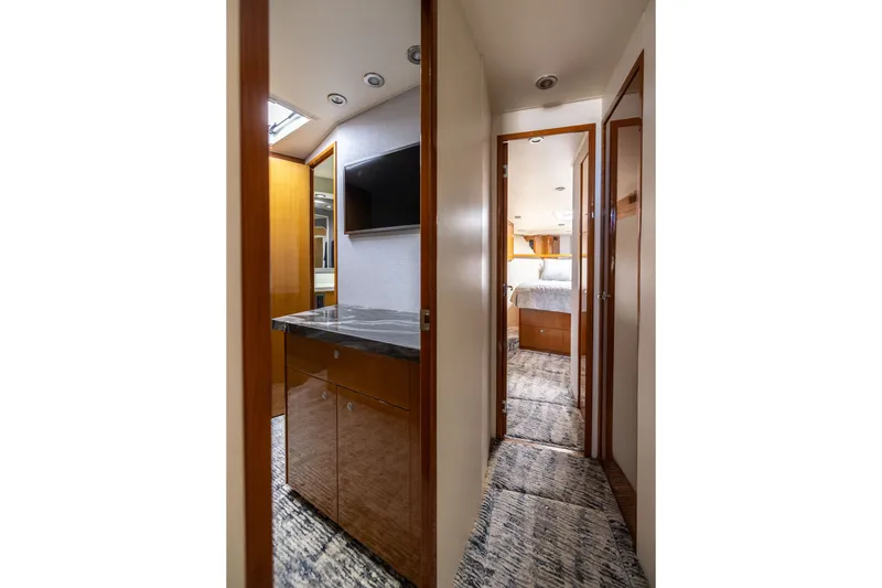Slide: The Image of Interior hallway of 2001 Viking 55 Convertible yacht with modern wood finishes. - 46