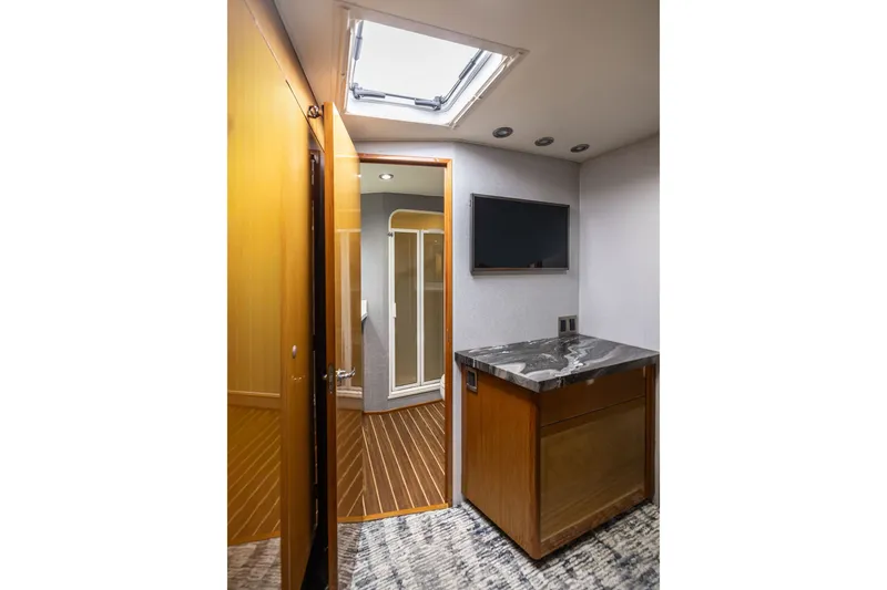 Slide: The Image of Interior of 2001 Viking 55 Convertible yacht with modern bathroom and wooden cabinetry. - 44