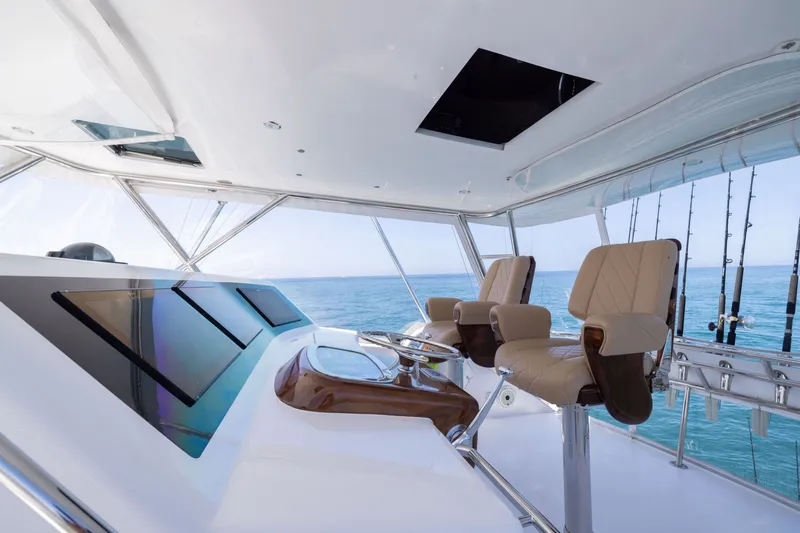Slide: The Image of Luxurious helm of a 2001 Viking 55 Convertible yacht with ocean view. - 10