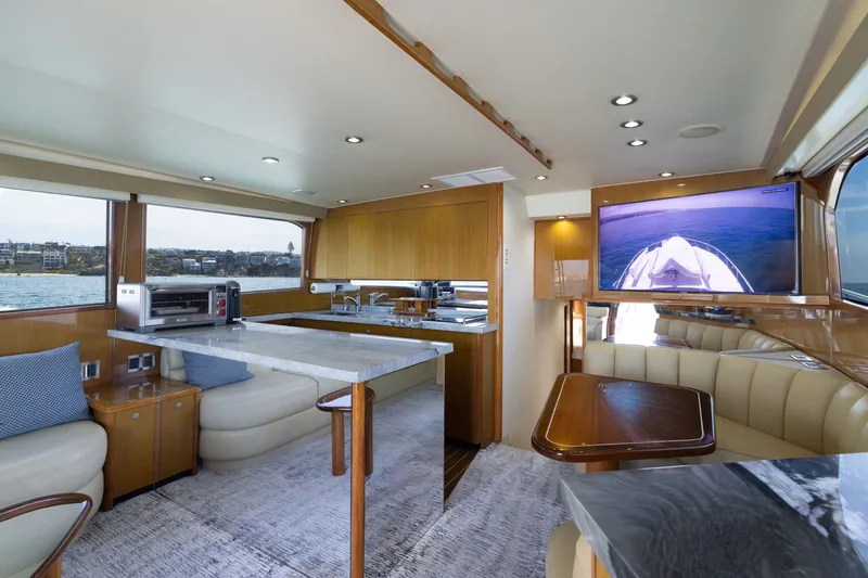 Slide: The Image of Luxurious interior of a 2001 Viking 55 Convertible yacht with modern amenities and scenic views. - 37